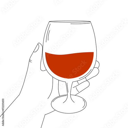 Hand holding glass of cognac on white background for pub logo or alcohol menu design in black and white style, time to relax concept