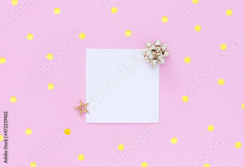 blank letterhead greeting card with gold sequins on pastel pink background with place for text	
