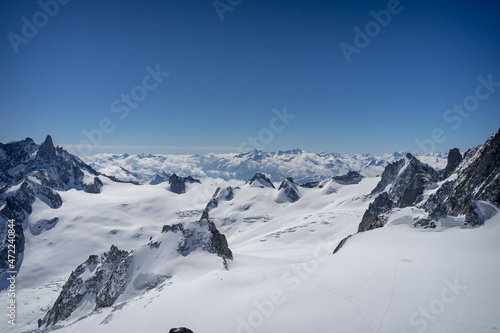 A view of the French Alps, Swiss Alps, and Italian Alps on a sunny summer day from the Aiguille du Midi near Mont Blanc in Chamonix, France © Sitting Bear Media