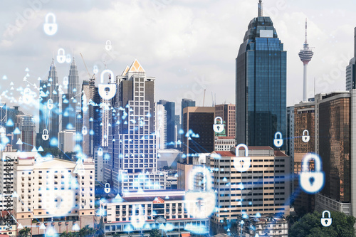 Photography Hologram of padlock icons over panoramic city view of Kuala Lumpur to protect business, Malaysia, Asia