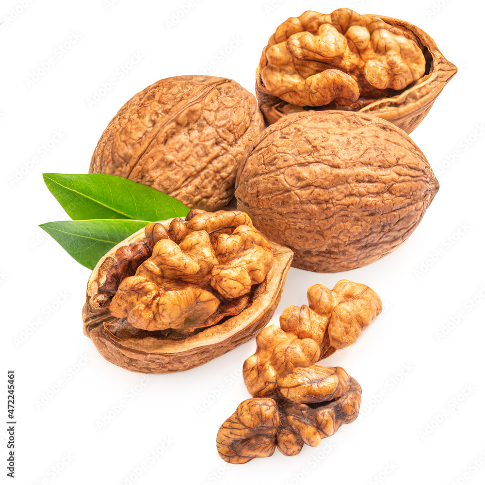 Walnut Isolated. Walnut kernel Nut with green leaves on white background. . Walnut Isolated. Walnut kernel Nut with green leaves on white background. .
