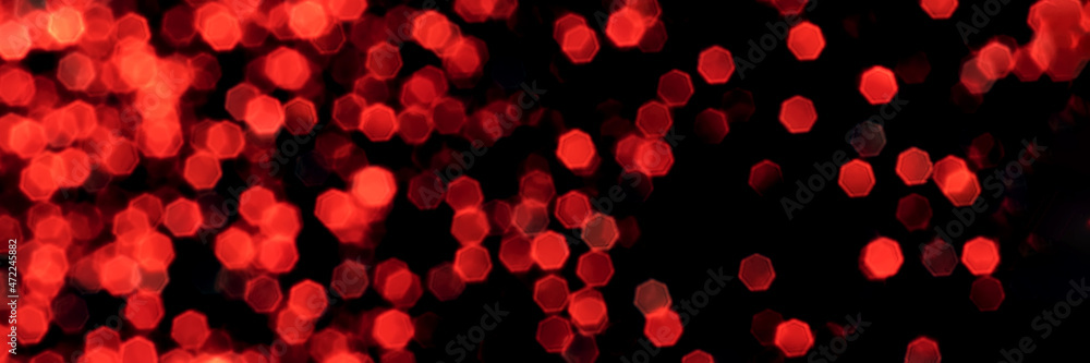 Blurred lights red bokeh background. Abstract defocused header. Wide screen wallpaper. Panoramic web banner with copy space for design Blurred lights red bokeh background. Abstract defocused header. Wide screen wallpaper. Panoramic web banner with copy space for design