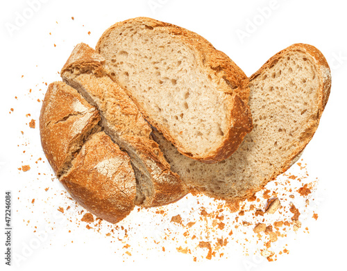 Freshly baked Bread with crumbs  isolated on white background.  Sliced, cutted wheat bread. Bakery, rustic  traditional food concept. Top view.