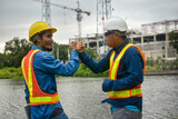 Teamwork Engineer and businessman handshake at construction site