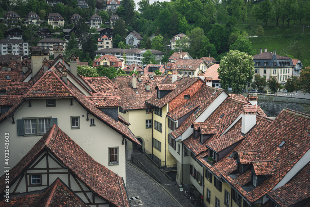 A view of the cityscape of Bern, Switzerland with stone rooftops and streets below