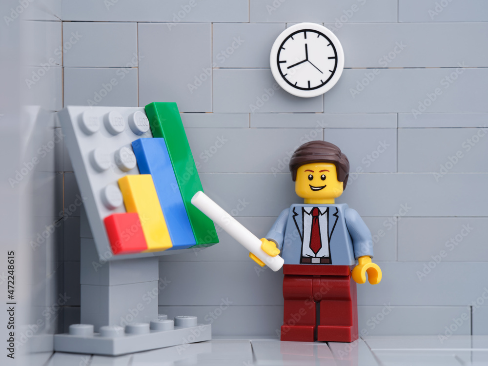Tambov, Russian Federation - November 26, 2021 Lego businessman minifigure  pointing out company growth on a chart. Stock Photo | Adobe Stock