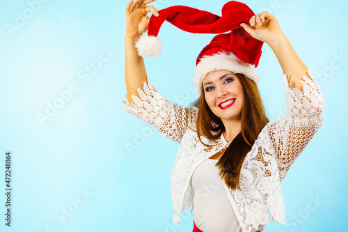 Joyful woman in christmas santa hat