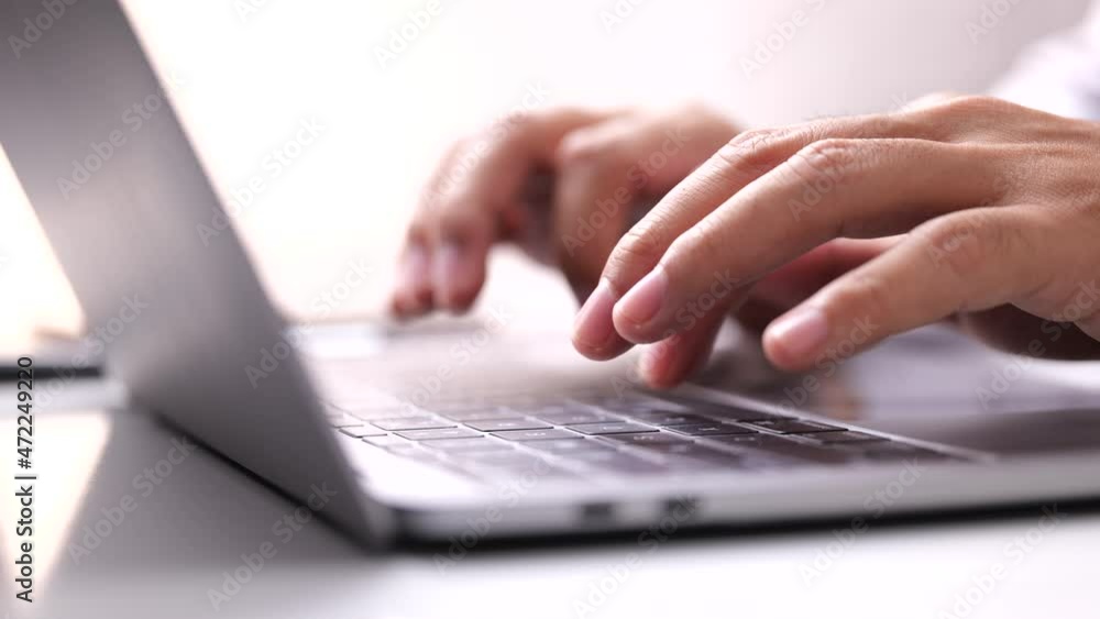 Close-up of Male hand typing laptop keyboard. Close-up of Male hand typing laptop keyboard.