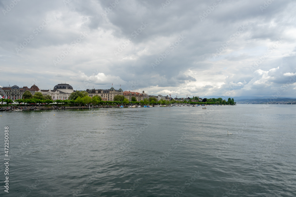 The Limmat River flows into Lake Zurich (Zurichsee) on a cloudy spring afternoon in Zurich, Switzerland