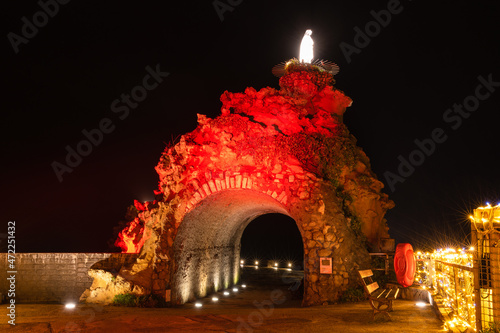 Biarritz Virgin Rock with red lightings. Christmas celebration 2021. Basque Country of France.