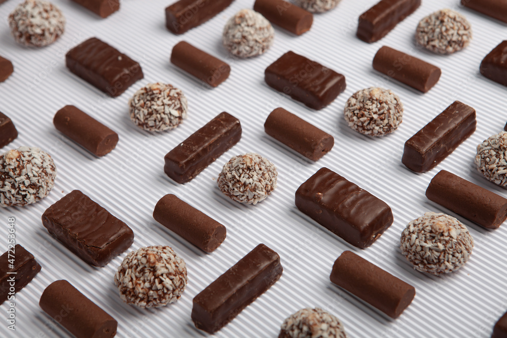 Festive Happy New Year's table full of chocolates. Assortment of delicious chocolate candies background Festive Happy New Year's table full of chocolates. Assortment of delicious chocolate candies background