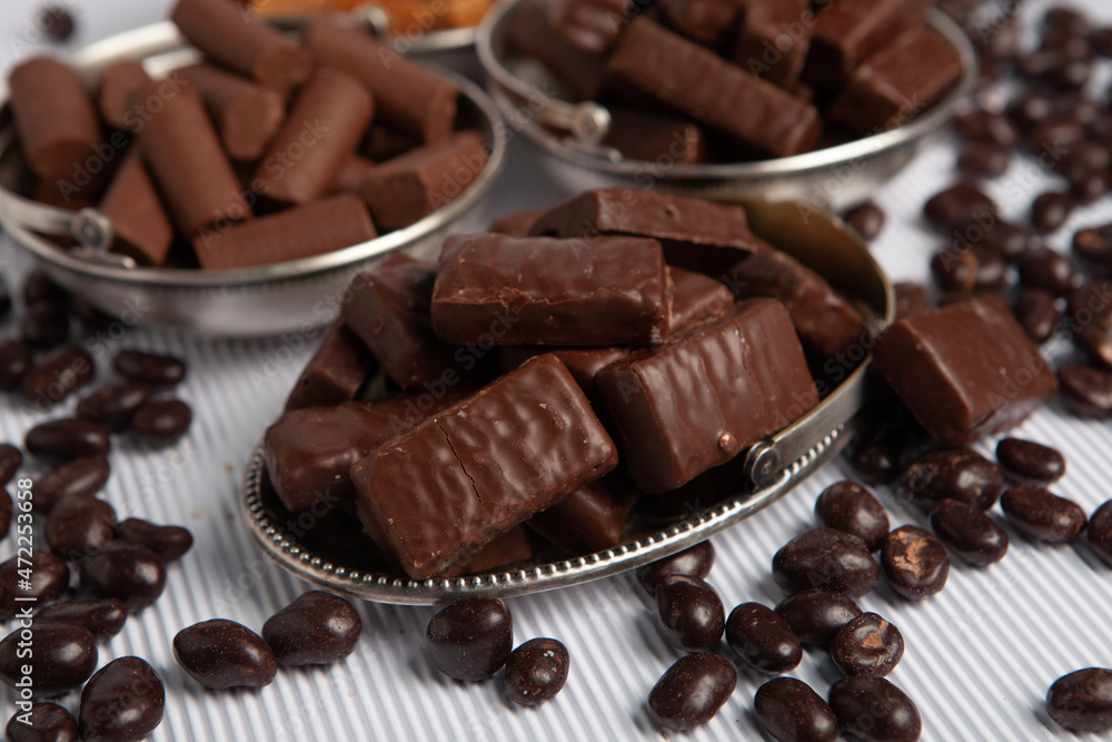 Festive Happy New Year's table full of chocolates. Assortment of delicious chocolate candies background Festive Happy New Year's table full of chocolates. Assortment of delicious chocolate candies background