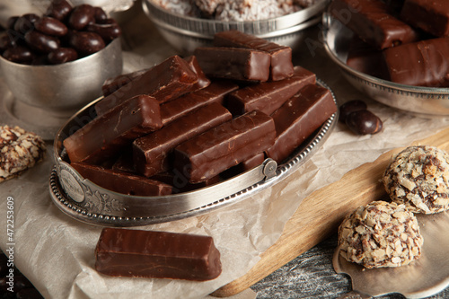 Festive Happy New Year's table full of chocolates. Assortment of delicious chocolate candies background