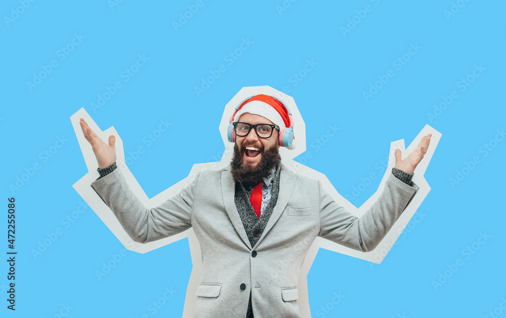 A handsome charismatic guy with a beard, glasses and Santa Claus hat experiences pleasant emotions. Collage in magazine style with happy emotions. Discount, sale, season sales. Colorful winter concept A handsome charismatic guy with a beard, glasses and Santa Claus hat experiences pleasant emotions. Collage in magazine style with happy emotions. Discount, sale, season sales. Colorful winter concept