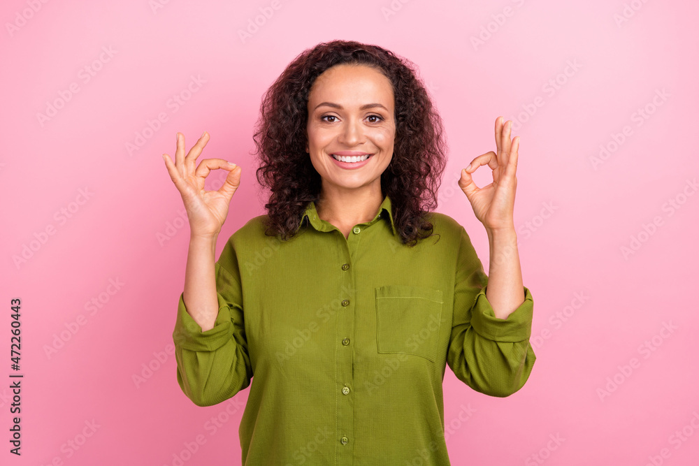 Photo of young joyful cheerful happy afro american woman show okay sing enjoy isolated on pink color background Photo of young joyful cheerful happy afro american woman show okay sing enjoy isolated on pink color background