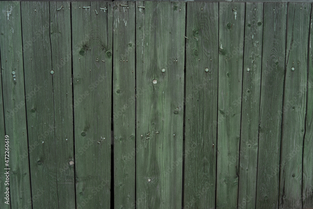 Background and texture of old wooden boards with remnants of paint. Background and texture of old wooden boards with remnants of paint.