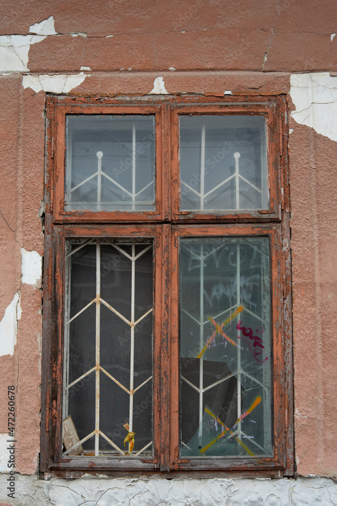 Fototapeta premium Old broken window in a wooden frame.
