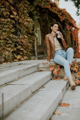 Young woman drinking takeaw...