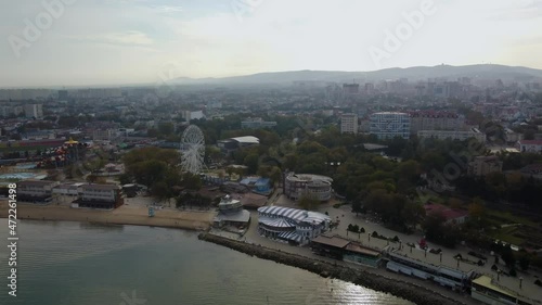 The resort of the Black Sea coast city of Anapa, Russia. The central city beach in the autumn. Top view from the sea. 4k drone video