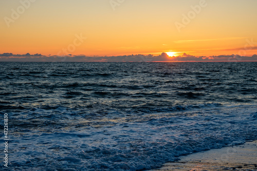 cold autumn sea and sky during sunset. the end of the day at sea