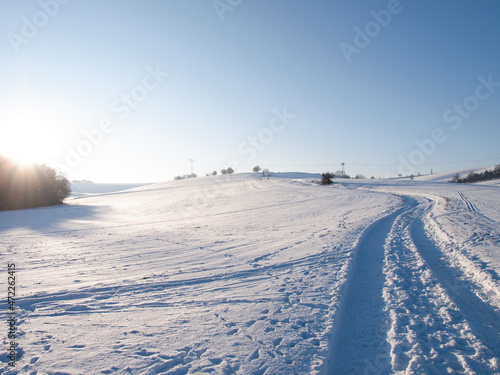 Road in a snowy field