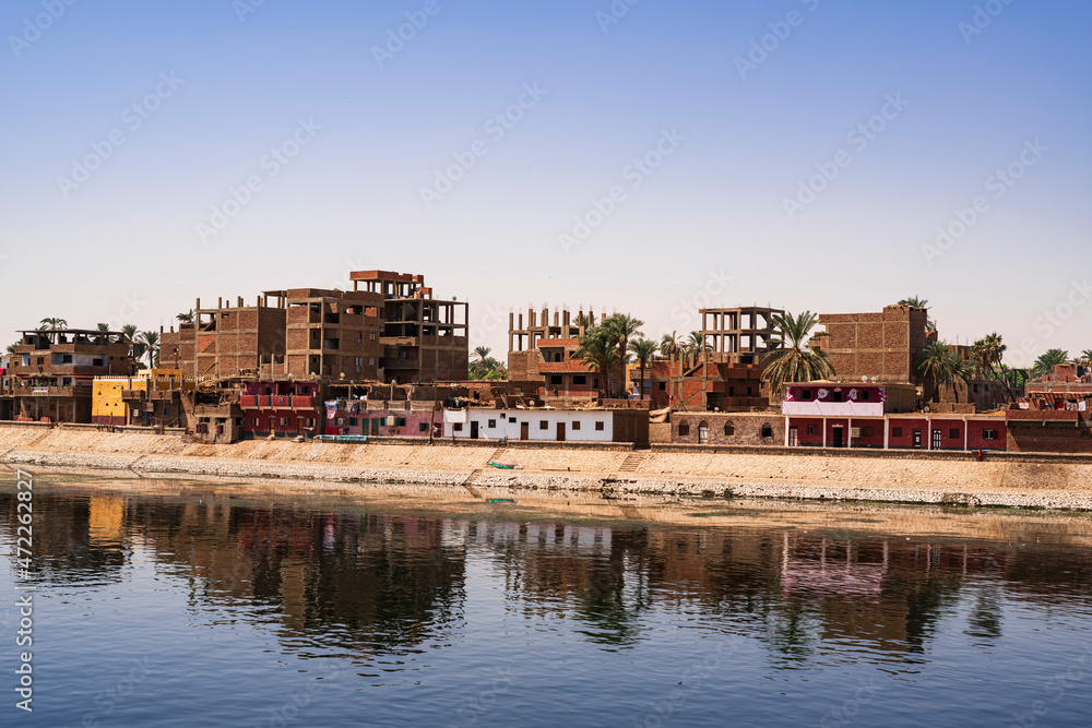 View of some unfinished buildings, an example of the poverty that exists in Egypt across the Nile River. Photograph taken in Aswan, Egypt. 