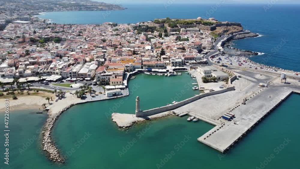 Crete, Greece. Harbor with marine vessels, boats and lighthouse. Rethymno Crete, Greece. Harbor with marine vessels, boats and lighthouse. Rethymno