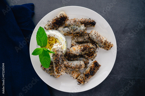 Halloumi Cheese and Mint Spring Rolls Topped with Za'atar Spice Mix: Middle Eastern-style spring roll appetizer served with labneh cheese dip photo