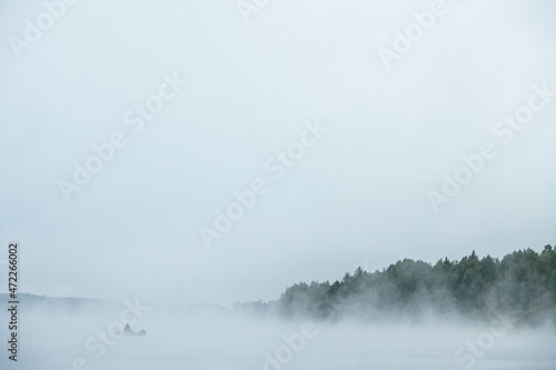 morning fog with a fisherman's boat
