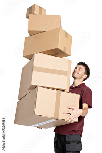Delivery man with parcels . Handsome happy young delivery man holding cardboard boxes and smiling at camera isolated on white