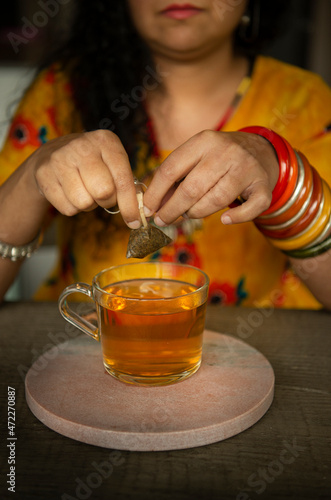 Woman with bagels drinking tea  photo