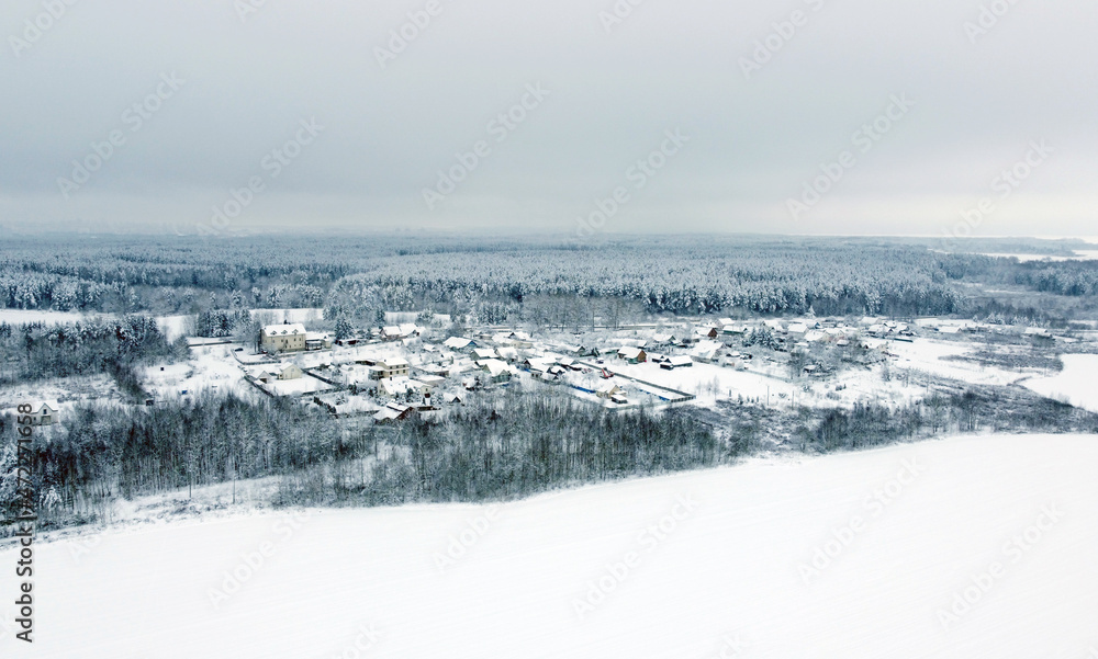 Aerial view of the winter landscape. White fields of suburban villages Aerial view of the winter landscape. White fields of suburban villages