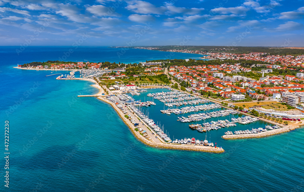 Zadar, Croatia - Aerial view of Zadar yacht marina with sailboats, yachts, blue sky and turquoise Adriatic sea water on a sunny summer day