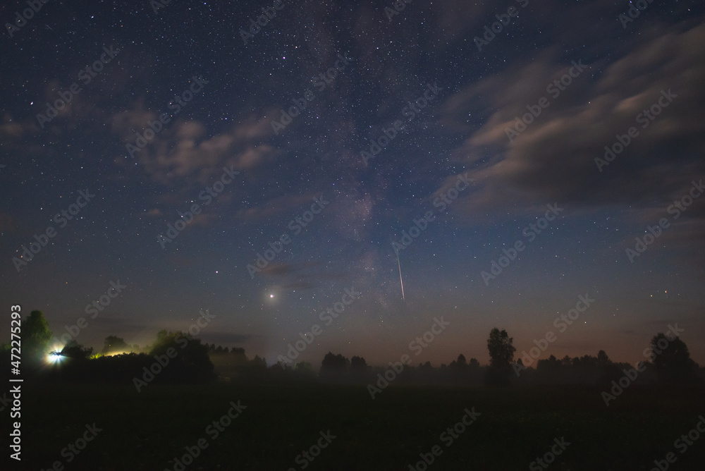 Night sky with milky way over the forest summer night Night sky with milky way over the forest summer night