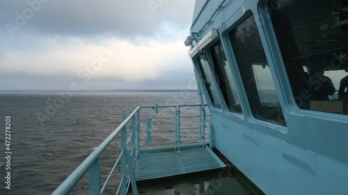 Close-up of the wheelhouse. The captain's bridge. Reflections of the sea are visible in the windows of the bridge.