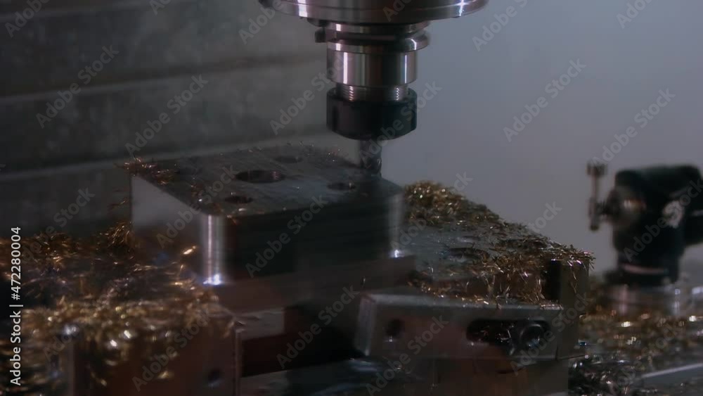 Close-up of idle drill machine and many metallic shavings. Close-up of idle drill machine and many metallic shavings.