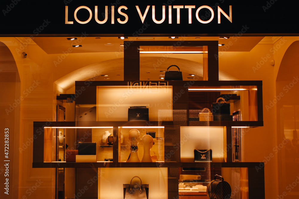 Louis Vuitton boutique with golden logo for advertising. Female fashion  handbags at the display window. The company is one of the world's leading  fashion houses with more than 460 stores worldwide. Stock