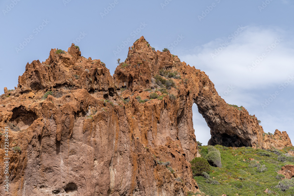 Natural arch in Scandola Nature Reserve, Corsica, France 