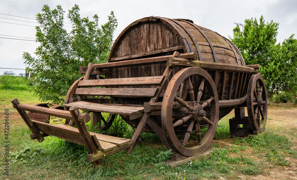 huge wooden barrel on wheels