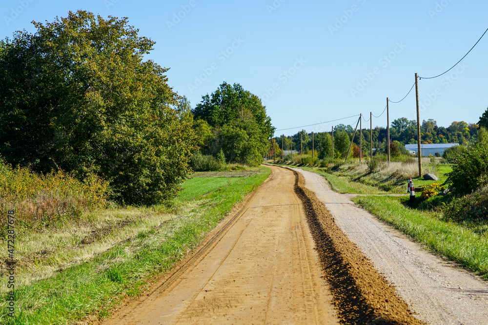 gravel road leveling in rural areas with the help of a grader gravel road leveling in rural areas with the help of a grader