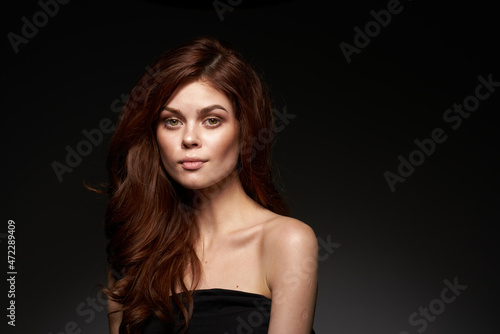 beautiful woman black dress posing studio fashion hairstyle close-up