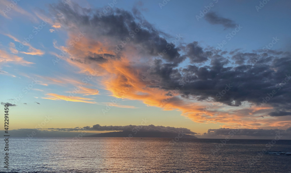 Beautiful sunset over the ocean with dramatic clouds and sky. From the Canary islands in the Atlantic ocean - Spain.