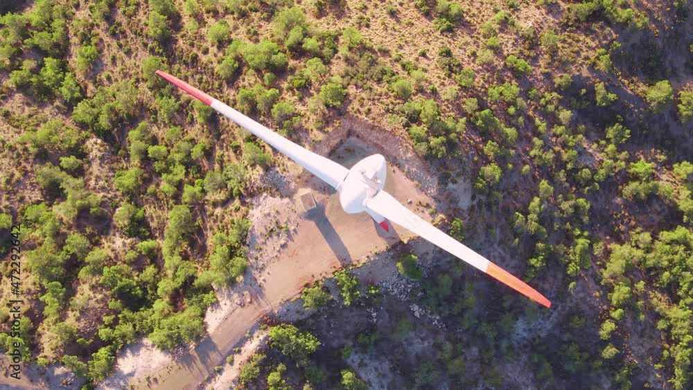 Wind turbine sustainable energy by rotating blades the power, over aerial view, renewable is collected from wind resources Wind turbine sustainable energy by rotating blades the power, over aerial view, renewable is collected from wind resources