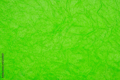 Green crumpled paper decorative background texture