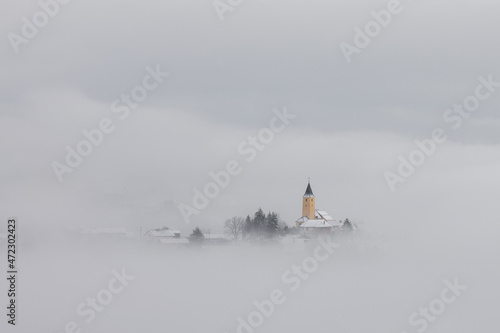 Winter in Croatia. Church. Fog. Snow