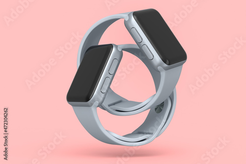 Set of silver smart watches or fitness tracker isolated on pink background.