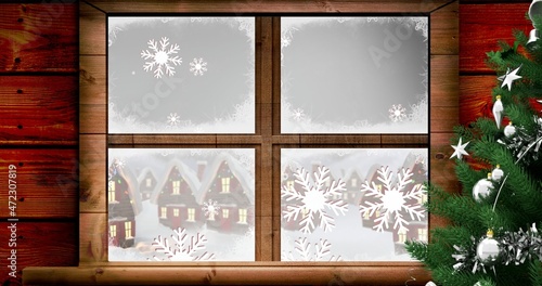 Vector image of snow covered houses seen through window by christmas tree  copy space