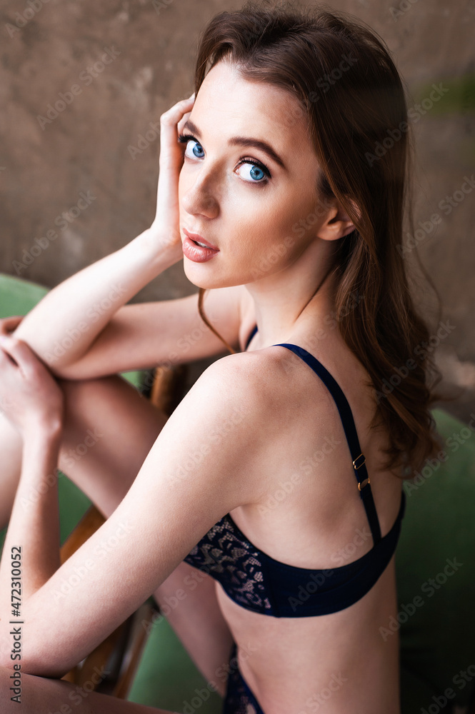 Beautiful petite european woman in brown and black lingerie Beautiful petite european woman in brown and black lingerie