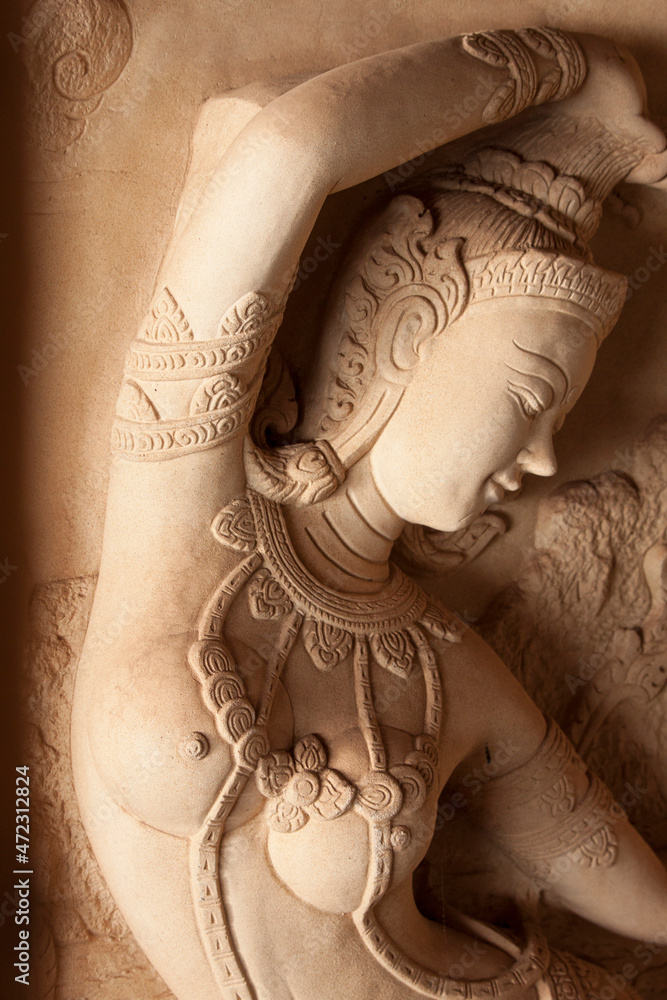 Thailand, Ko Samui. Carved stone relief of a Hindu deity. - obrazy, fototapety, plakaty 