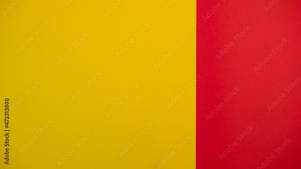 Red and yellow colored background. Colourful paper on top. Template for text or concept. Advertising mock up. Presentation flat lay mock up Red and yellow colored background. Colourful paper on top. Template for text or concept. Advertising mock up. Presentation flat lay mock up